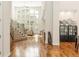 Bright living room with soaring ceilings, hardwood floors, grand staircase and plenty of natural light at 155 S Poplar St, Denver, CO 80230