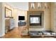 Cozy living room featuring fireplace, and hardwood floors throughout at 155 S Poplar St, Denver, CO 80230