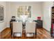 Bright office space with hardwood flooring and ample natural light from large window at 155 S Poplar St, Denver, CO 80230