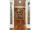 Elegant wine cellar with hardwood flooring and beautiful etched glass doors at 155 S Poplar St, Denver, CO 80230