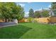 Spacious backyard with healthy lawn and a wooden fence at 5612 S Jebel Way, Centennial, CO 80015