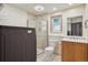 Bathroom featuring a walk-in shower, a vanity with a sink, and a toilet, as well as in unit laundry at 5612 S Jebel Way, Centennial, CO 80015