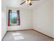 Clean, sunlit room featuring plush carpet, neutral walls, and a ceiling fan, offering a cozy, comfortable feel at 5612 S Jebel Way, Centennial, CO 80015