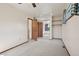 Spacious carpeted room featuring a closet with mirror doors, and a fan, offering a comfortable and stylish space at 5612 S Jebel Way, Centennial, CO 80015