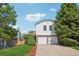 Traditional two-story home with a well-manicured lawn and two-car garage at 5612 S Jebel Way, Centennial, CO 80015