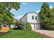 Two-story home featuring a two-car garage, landscaped yard, and mature trees, perfect for suburban living at 5612 S Jebel Way, Centennial, CO 80015