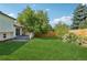 Narrow brick pathway between houses with landscaping at 5612 S Jebel Way, Centennial, CO 80015