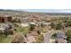 Picturesque aerial view of the neighborhood featuring mature landscaping with mountains visible in the distance at 14533 W 3Rd Ave, Golden, CO 80401