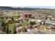Picturesque aerial view of the neighborhood with beautiful mountains and the city visible in the distance at 14533 W 3Rd Ave, Golden, CO 80401