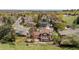 Aerial shot of this home's manicured lawn, established trees, back patio and adjacent neighborhood street at 14533 W 3Rd Ave, Golden, CO 80401