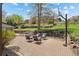 Private backyard with a brick patio, landscaping, retaining wall, and basketball hoop at 14533 W 3Rd Ave, Golden, CO 80401