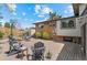 Inviting backyard with a brick patio, outdoor seating, mature trees, and well-manicured lawn at 14533 W 3Rd Ave, Golden, CO 80401