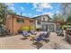 Spacious backyard with a brick patio, lush landscaping, and comfortable outdoor seating at 14533 W 3Rd Ave, Golden, CO 80401