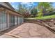 Charming stone patio with landscaping and mature trees at 14533 W 3Rd Ave, Golden, CO 80401