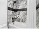 Modern bathroom with gray marble tiles and bathtub at 14533 W 3Rd Ave, Golden, CO 80401