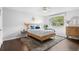 Bedroom with accent wall, modern fan and natural lighting at 14533 W 3Rd Ave, Golden, CO 80401
