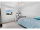 Bright bedroom with a light blue bedspread and view to the outside at 14533 W 3Rd Ave, Golden, CO 80401