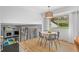 Eat in kitchen dining room space with round table and updated light fixture at 14533 W 3Rd Ave, Golden, CO 80401