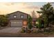 Charming home featuring a two-car garage, brick accents, and well-manicured landscaping at 14533 W 3Rd Ave, Golden, CO 80401