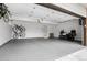 Spacious three-car garage with epoxy flooring, bike storage, and ample space for vehicles at 14533 W 3Rd Ave, Golden, CO 80401