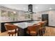 Kitchen with large island, modern appliances, and custom backsplash at 14533 W 3Rd Ave, Golden, CO 80401
