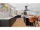 Beautiful kitchen with sleek countertops, an island with seating, and stainless steel appliances at 14533 W 3Rd Ave, Golden, CO 80401