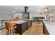 Open-concept kitchen with large island featuring cooktop and seating, perfect for entertaining at 14533 W 3Rd Ave, Golden, CO 80401