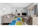 Bright living room featuring hardwood floors, fireplace, and stylish furnishings at 14533 W 3Rd Ave, Golden, CO 80401