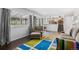 Spacious and bright living room with hardwood floors, skylights, and modern furnishings at 14533 W 3Rd Ave, Golden, CO 80401