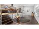 Open floor plan with updated living space, desk, and kitchen view at 14533 W 3Rd Ave, Golden, CO 80401