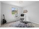 Bright office with desk, chair, guitar and natural light from the window at 14533 W 3Rd Ave, Golden, CO 80401