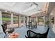 Bright sunroom with ample natural light, modern furnishings, and picturesque backyard views at 14533 W 3Rd Ave, Golden, CO 80401