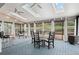 Inviting sunroom with skylights, ceiling fans, and large windows overlooking the backyard at 14533 W 3Rd Ave, Golden, CO 80401