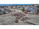 An elevated rear view of a blue two-story house with a deck and fenced yard at 4688 Cedar Glen Pl, Castle Rock, CO 80109