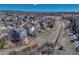 An elevated rear view of a blue two-story house with a deck and fenced yard at 4688 Cedar Glen Pl, Castle Rock, CO 80109