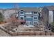 Rear exterior showing a two-story blue home with a deck and yard at 4688 Cedar Glen Pl, Castle Rock, CO 80109