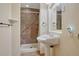 Bathroom features a pedestal sink and walk-in shower with attractive tile work at 4688 Cedar Glen Pl, Castle Rock, CO 80109