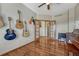 Music room with guitars and a piano features hardwood floors and neutral paint at 4688 Cedar Glen Pl, Castle Rock, CO 80109