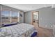 Cozy bedroom featuring large window, blue accents, and inviting decor at 4688 Cedar Glen Pl, Castle Rock, CO 80109