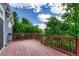 A wooden deck overlooking trees and sky with string lights overhead provides a relaxing outdoor space at 4688 Cedar Glen Pl, Castle Rock, CO 80109