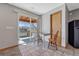 Bright dining area with access to outdoor grill and views of the backyard at 4688 Cedar Glen Pl, Castle Rock, CO 80109