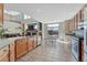 Bright kitchen with granite countertops and stainless steel appliances at 4688 Cedar Glen Pl, Castle Rock, CO 80109