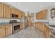 Spacious kitchen with stainless steel appliances, granite countertops, and plenty of cabinet space at 4688 Cedar Glen Pl, Castle Rock, CO 80109
