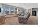 Inviting living room with ample natural light, plush seating, and a relaxing atmosphere at 4688 Cedar Glen Pl, Castle Rock, CO 80109