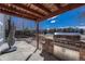 Outdoor kitchen and covered dining area provides ideal space for entertaining at 4688 Cedar Glen Pl, Castle Rock, CO 80109