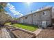 Spacious backyard includes a well-maintained lawn and garden area for outdoor enjoyment at 10983 W Exposition Pl, Lakewood, CO 80226