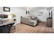 Finished basement with comfortable seating area, desk and office area, and stylish decor at 10983 W Exposition Pl, Lakewood, CO 80226