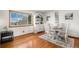 A sunny dining area with hardwood floors and a classic display cabinet at 10983 W Exposition Pl, Lakewood, CO 80226