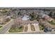 Charming ranch-style home featuring a two-car garage, a well-maintained lawn, and mature trees in a peaceful neighborhood at 10983 W Exposition Pl, Lakewood, CO 80226