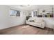 Bright room featuring natural light, built-in shelves, and a comfortable white couch at 10983 W Exposition Pl, Lakewood, CO 80226